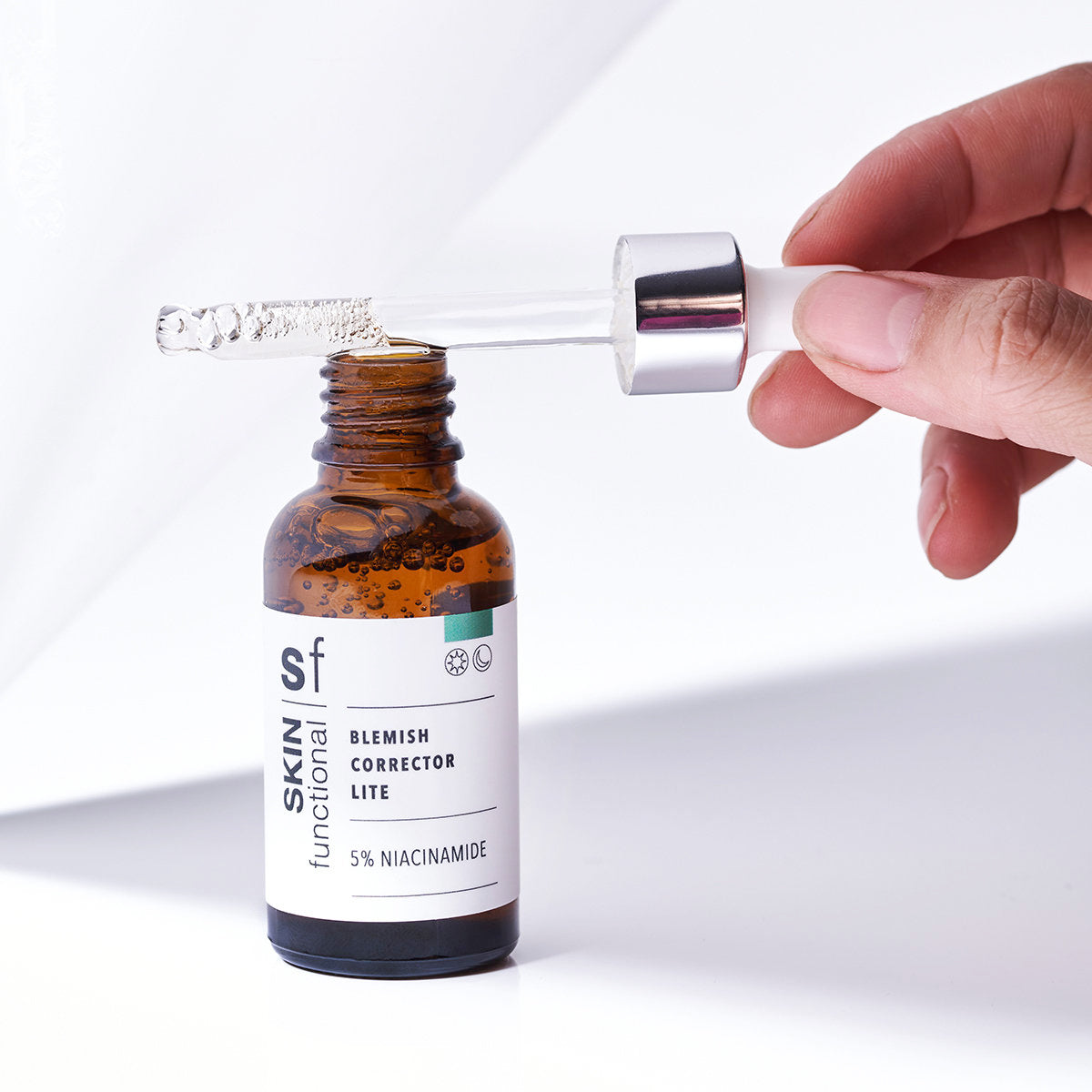 SKIN Functional Blemish Corrector Lite with details skincare product on a light gray background