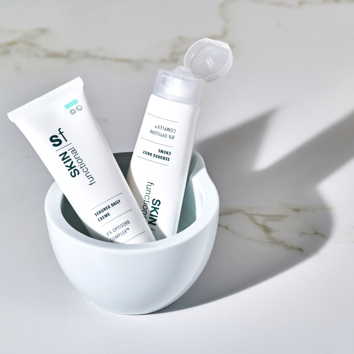 SKIN Functional Sebureg Daily Creme with product details skincare product on a light gray background