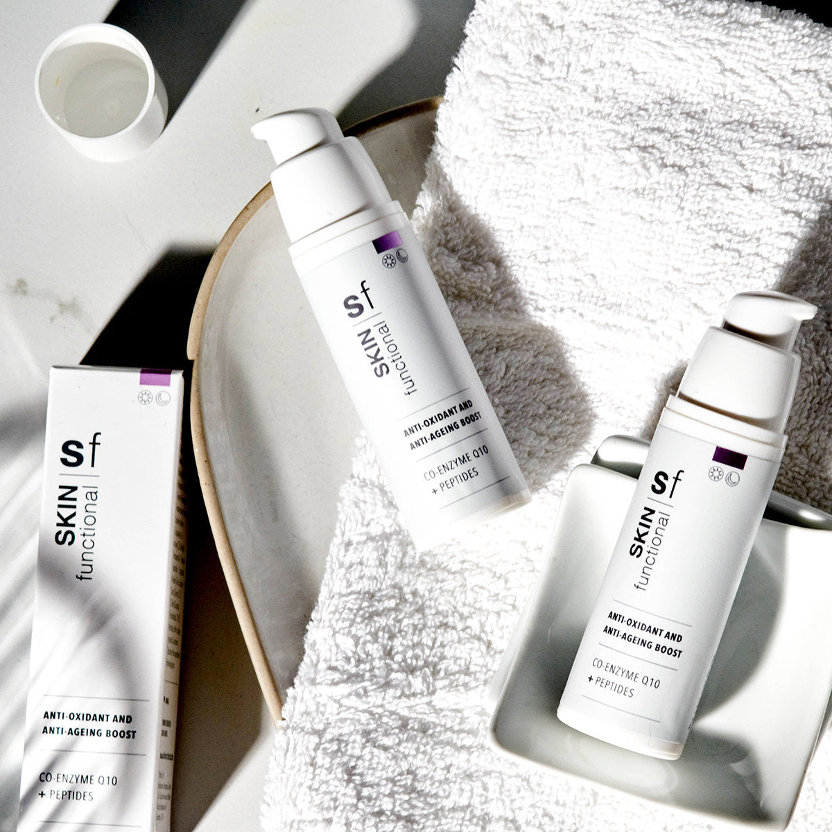 SKIN Functional Anti-Oxident and Anti-Ageing Boost with product details skincare product on a light gray background