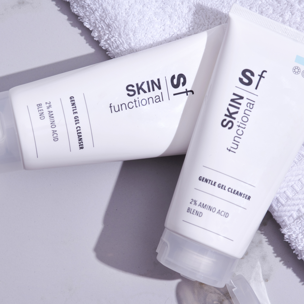 SKIN Functional Gentle Gel Cleanser with product details skincare product on a light gray background