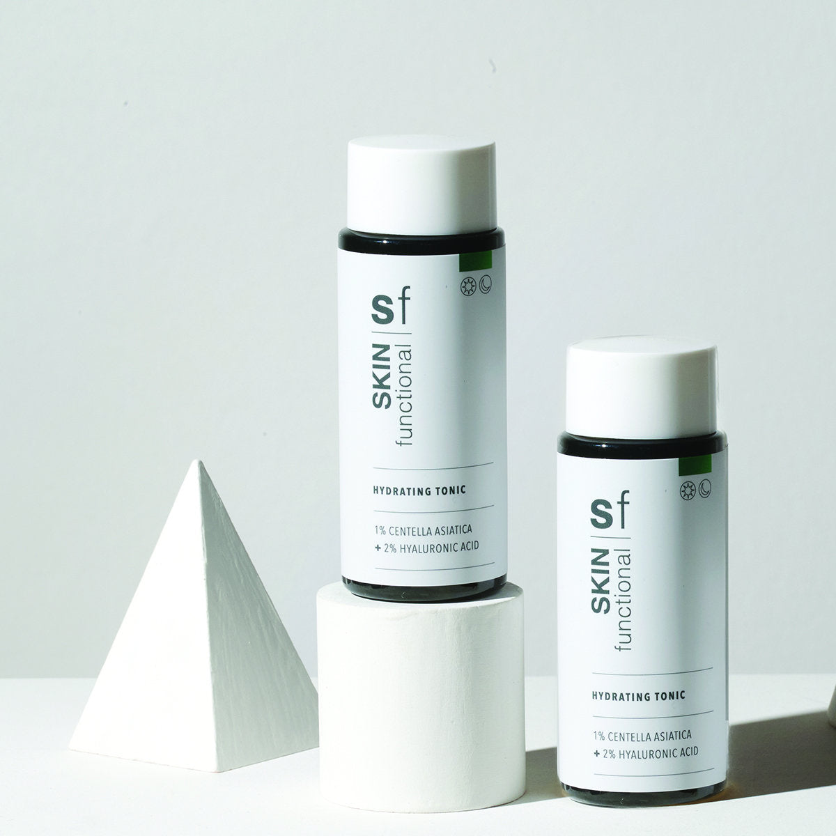SKIN Functional Hydrating Tonic with details skincare product on a light gray background