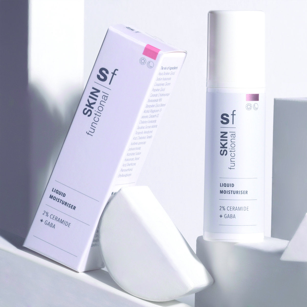 SKIN Functional liquid moisturiser with details skincare product on a grey background