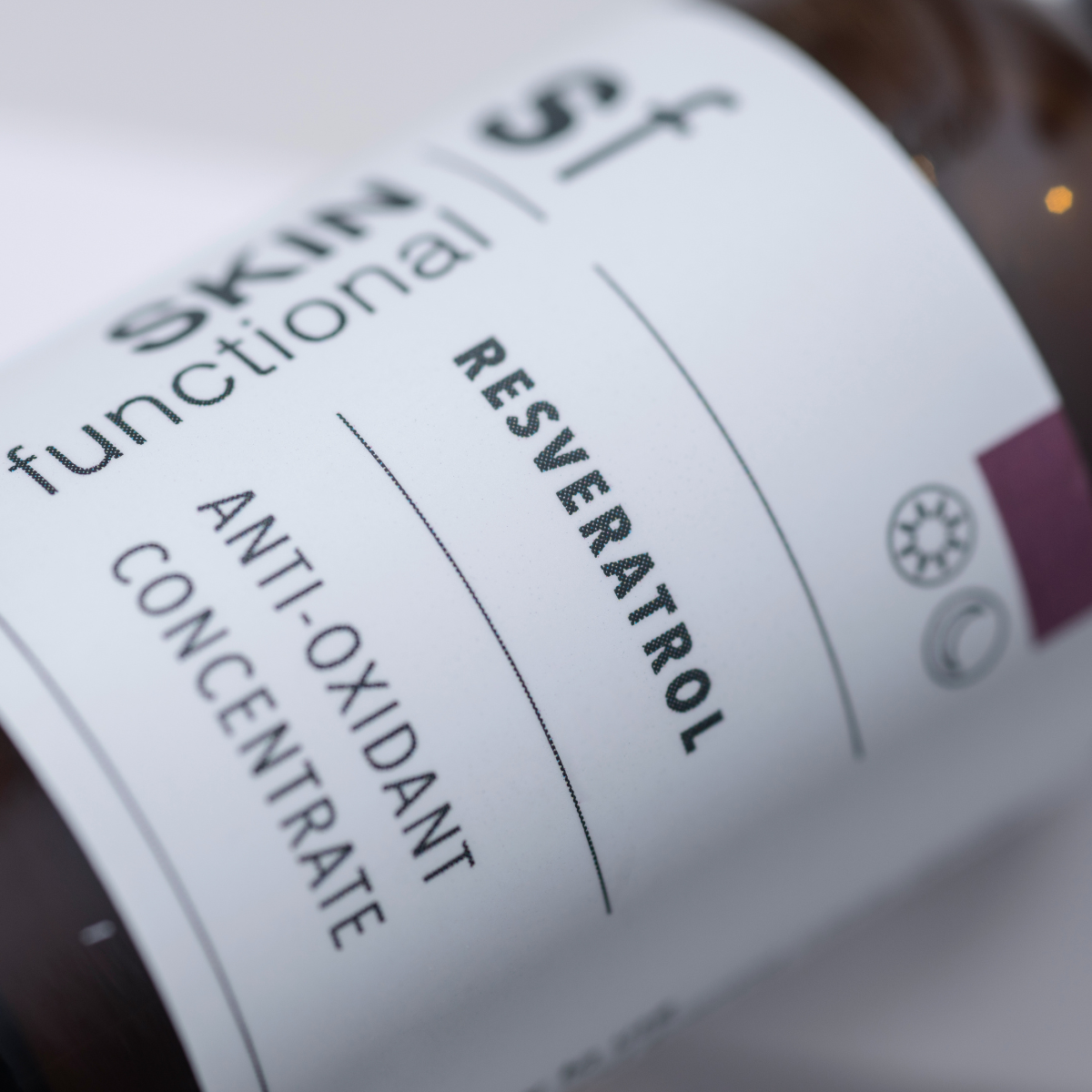 Close-up of a skincare product label with 'Resveratrol' and 'Anti-Oxidant Concentrate' text.