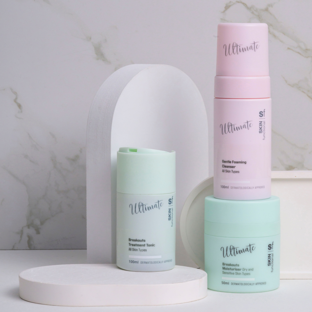 Three skincare products labeled 'Ultimate Skin Functional ' on a marble background