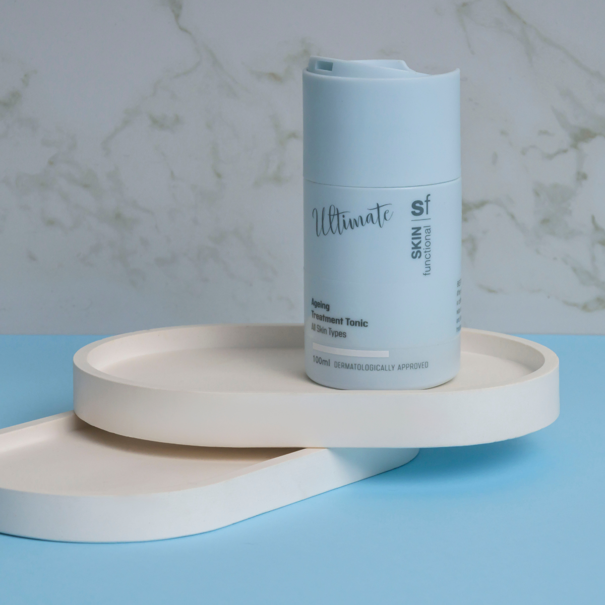 Skin Functional Ageing Treatment Tonic Moisturiser Skincare product bottle with packaging and background